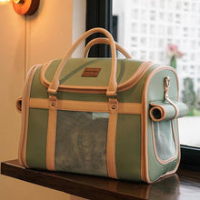 Load image into Gallery viewer, Vintage Green Leather Cat Carrier With Mesh Windows on Wooden Table | MissyMoMo
