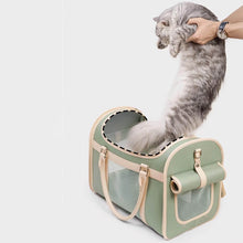 Load image into Gallery viewer, Cat Being Placed Into Top Opening Of Leather Pet Carrier | MissyMoMo
